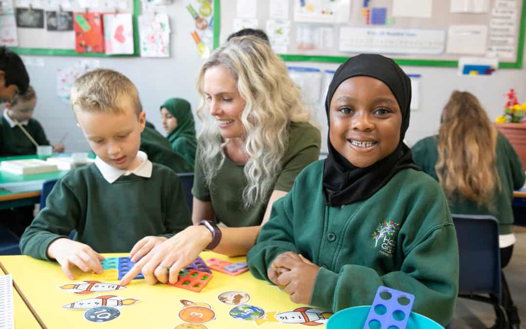 Image of pupils and staff at Hazel Grove Primary School