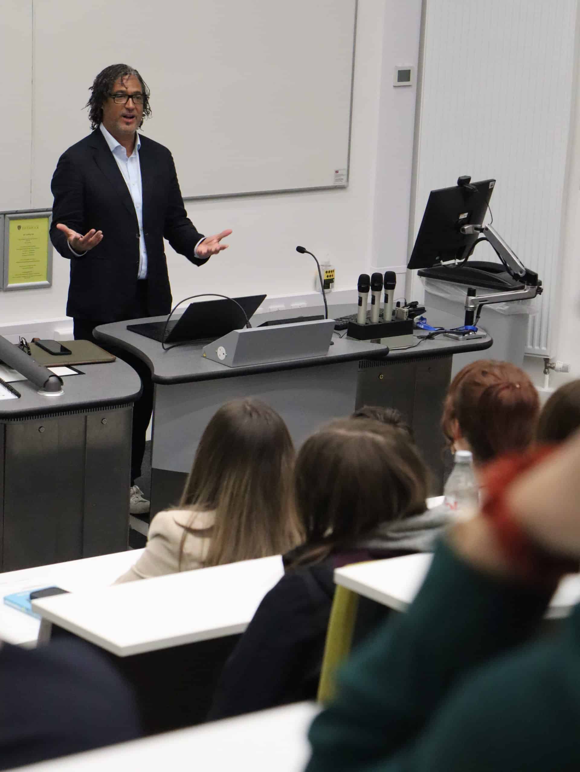 David Olusoga OBE delivers a talk to Apertura students in a lecture theatre at the University of Liverpool.